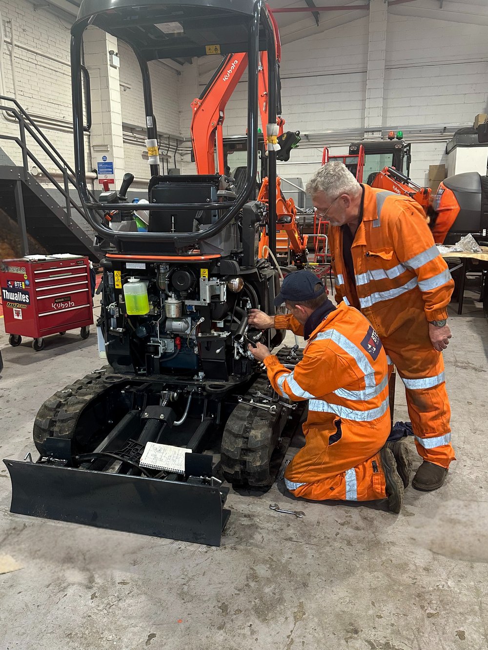 kubota-u17-in-workshop-with-service-engineers