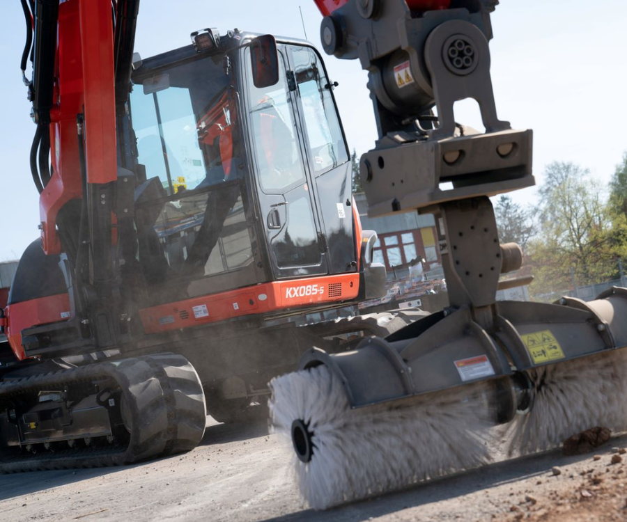 Kubota KX085-5 excavator with brush attachment