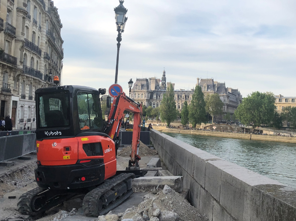 Kubota U36 rear - historical buildings by the river