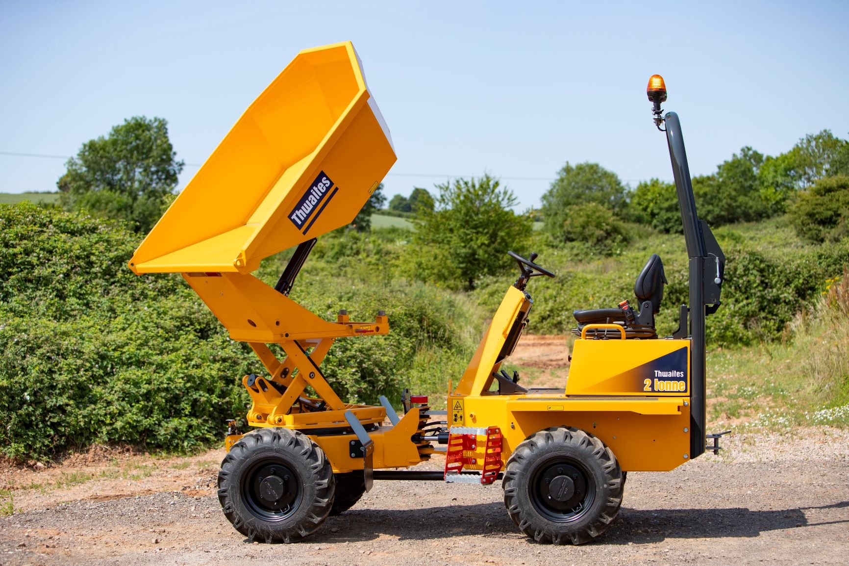 Thwaites 2 tonne hi swivel dumper with skip elevated