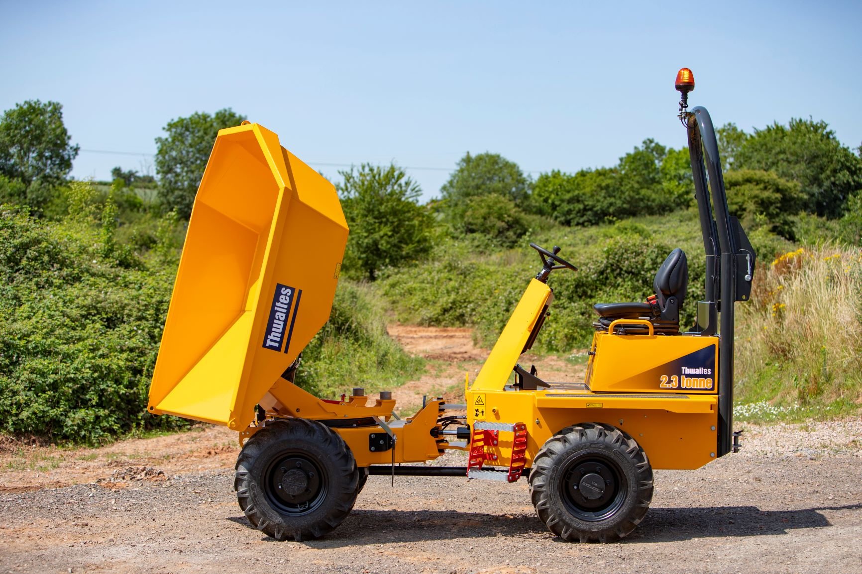 Thwaites 2.3 tonne dumper with skip tipping forward