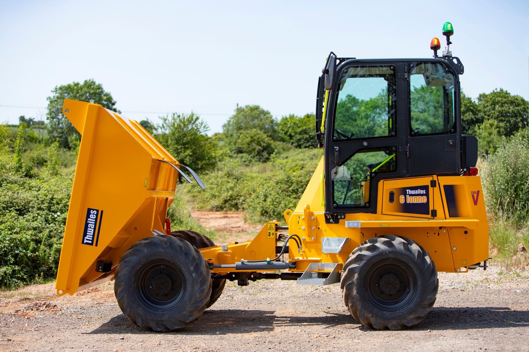 6 tonne front tip cabbed dumper with skip tipped forwards