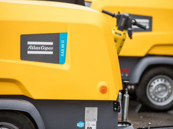 Atlas copco compressor XAS 88 with a breaker in the background