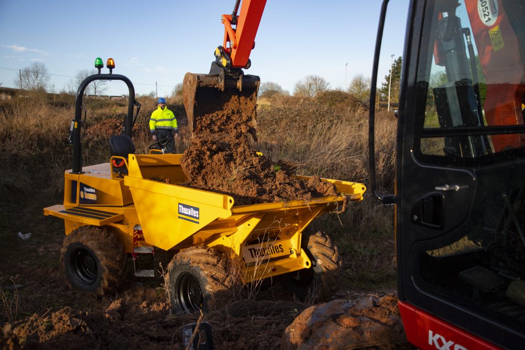 6 Tonne Front Tip – Stage 5 Thwaites dumper, the skip is being loaded with mud and rubble by a Kubota excavator