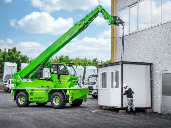 Merlo ROTO50.30S PLUS rotating telehandler can also be used as a typical telehandler, transporting heavy goods such as this cabinet