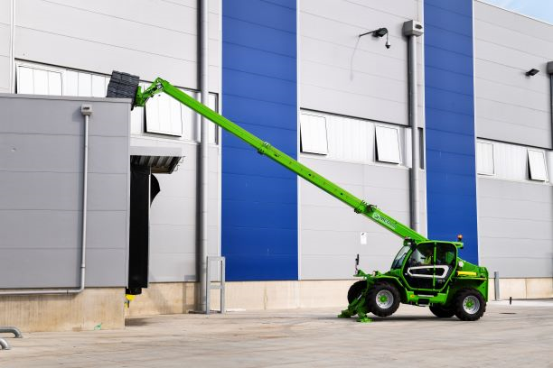 Merlo P40.13 stabilised telehandler with extended boom working on site
