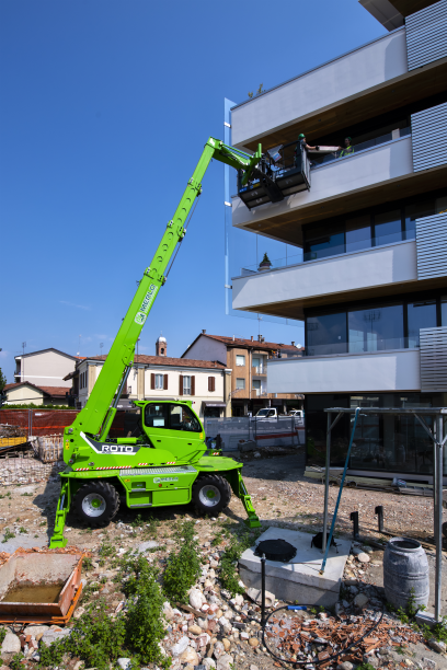 The Merlo ROTO40.18 S roto telehandler working on site with a man basket attached