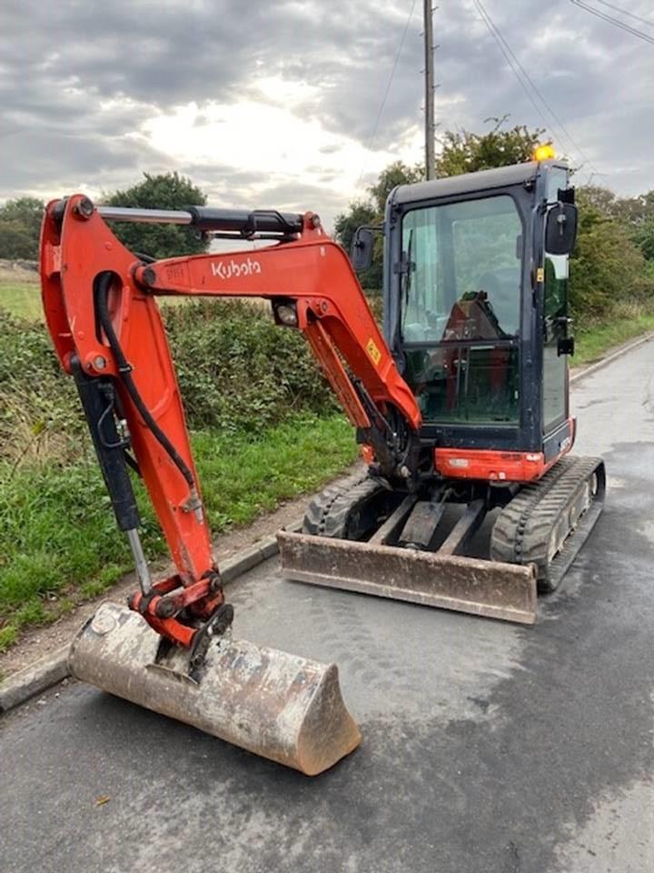 Used Kubota U27-4 for sale, year 2015, good working condition. Pictured facing forward with a ditching bucket attached