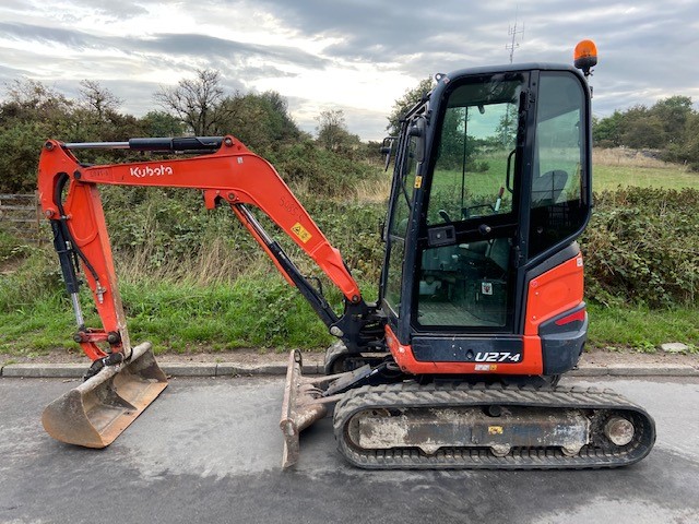 Used Kubota U27-4 for sale, year 2015, good working condition. Pictured facing left with a ditching bucket attached