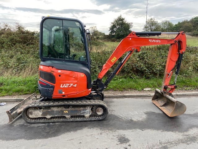 Used Kubota U27-4 mini excavator. Year 2015. Pictured facing right with a ditching bucket attached