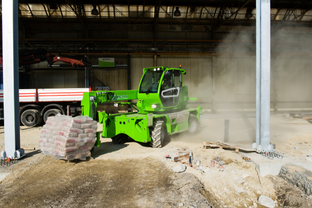 Merlo ROTO40.16 S rotating telehandler on site moving a pallet